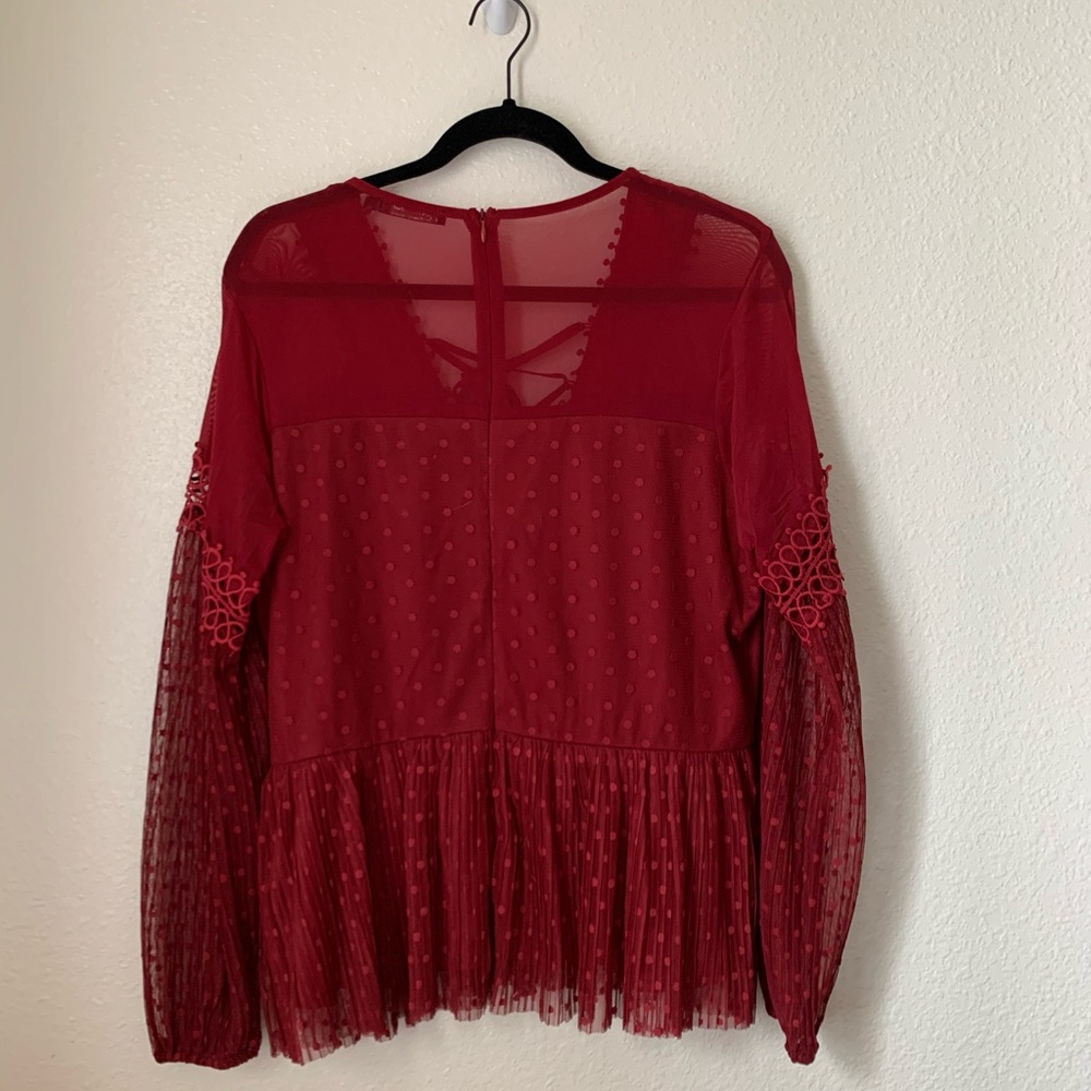 mesh peplum blouse with criss cross front